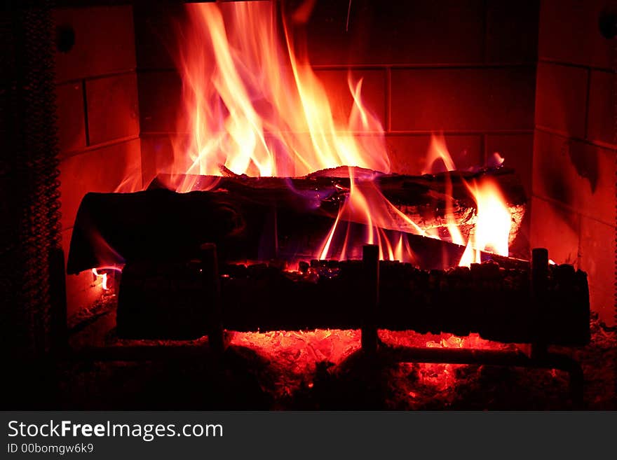 A warm, cozy, bright fire in the winter. A warm, cozy, bright fire in the winter