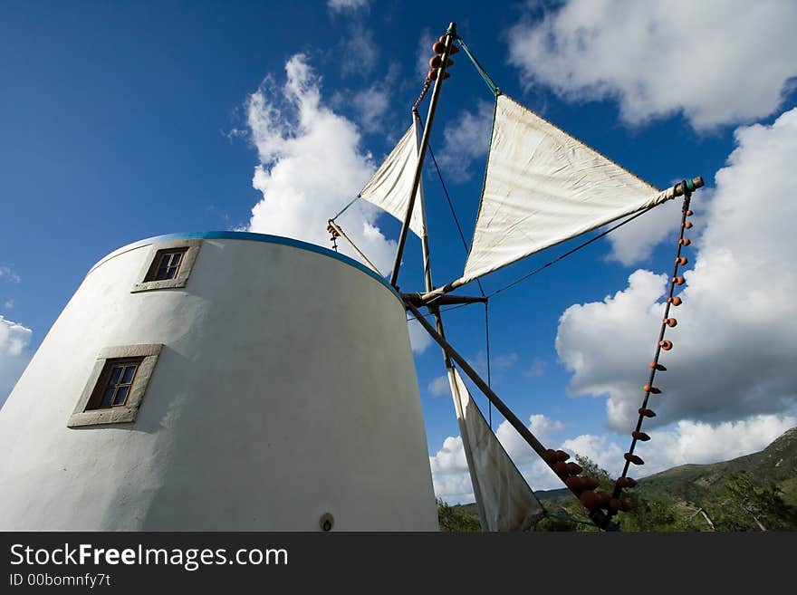 Windmill construction with blue sky background