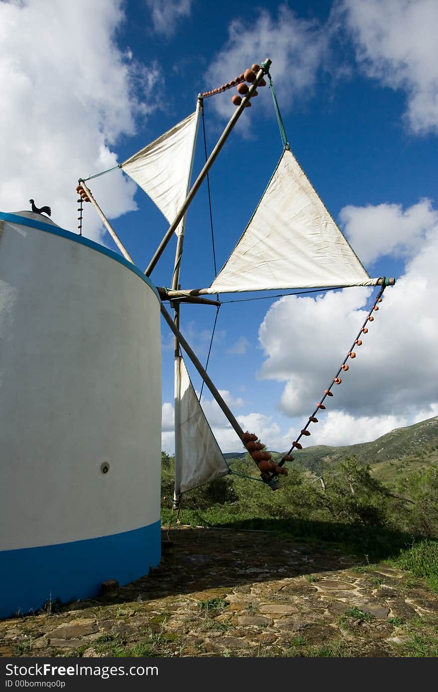 Windmill construction with blue sky background