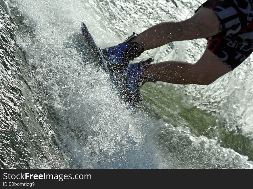 Wakeboard splash - young man wakeboarding