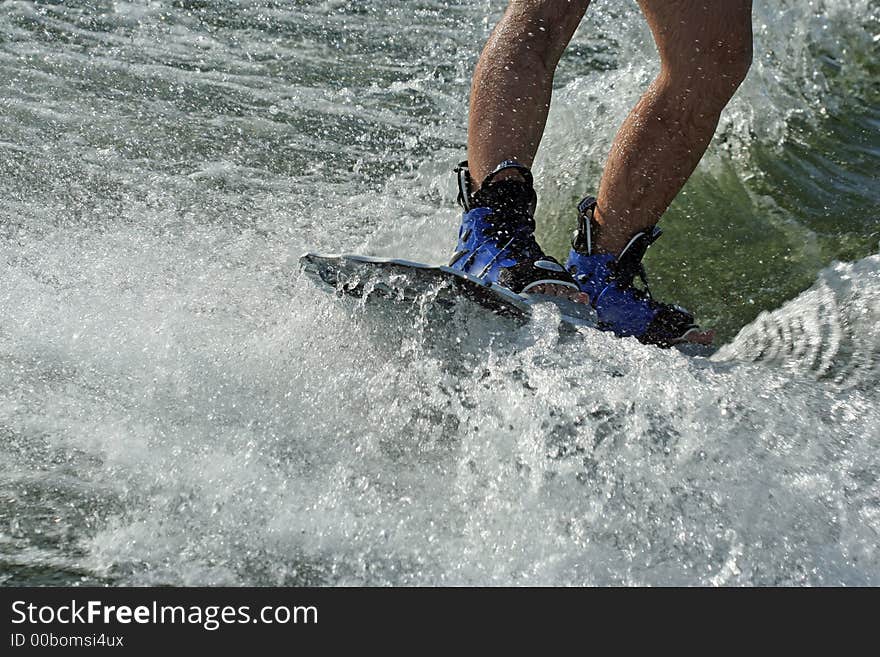 Wakeboard splash - young man wakeboarding