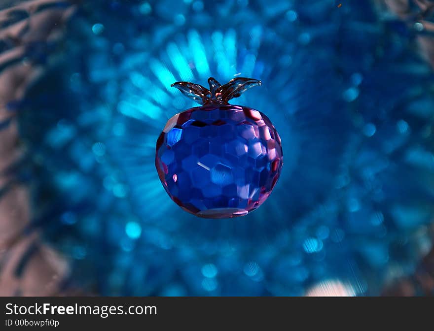 Purple crystal apple with blue crystal background