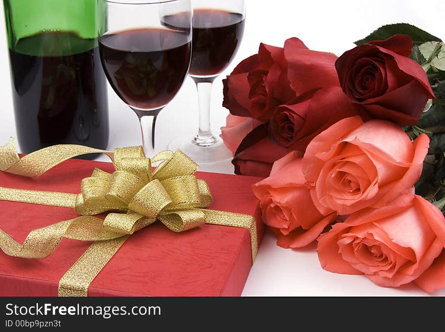 Rose with gift box and red wine. Rose with gift box and red wine.