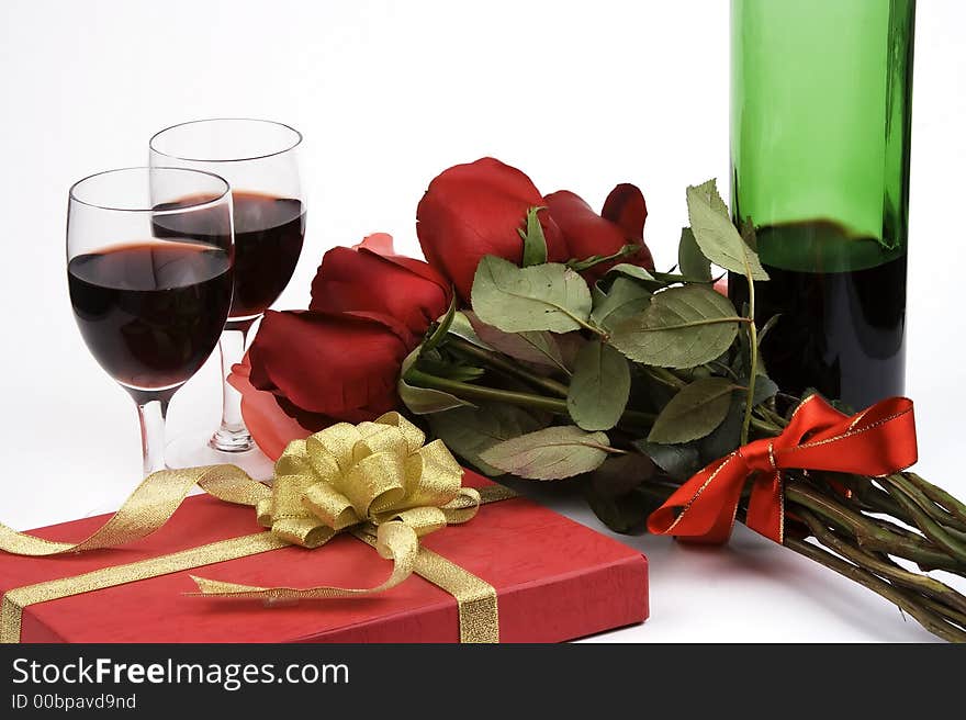 Rose with gift box and red wine. Rose with gift box and red wine.