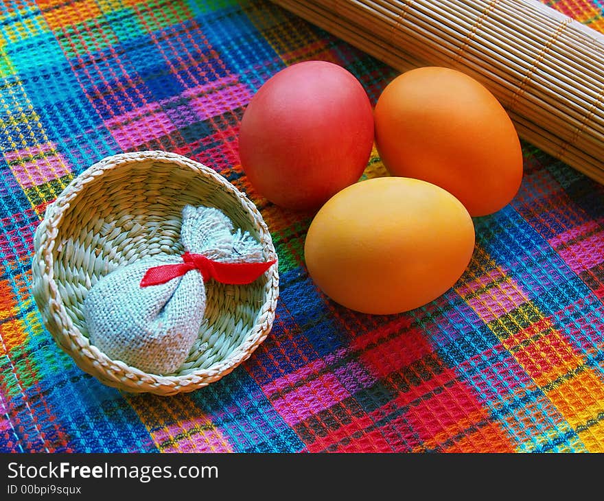 Tree eggs with small basket and linen sack. Tree eggs with small basket and linen sack