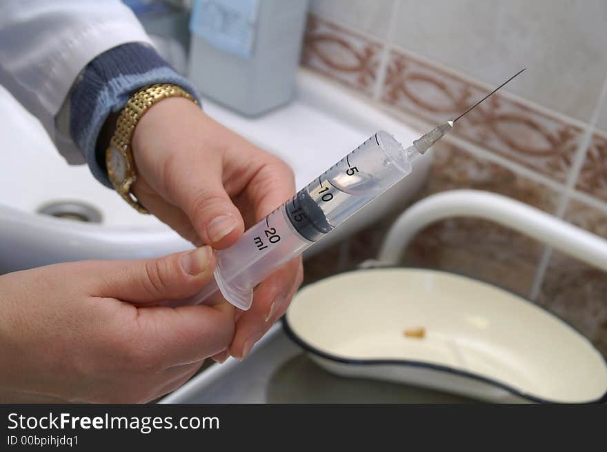 The syringe with a liquid in the medical room