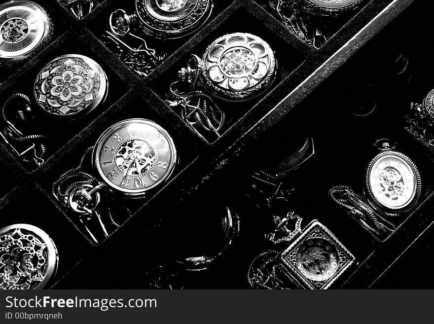 A closeup of a collection of clocks. A closeup of a collection of clocks