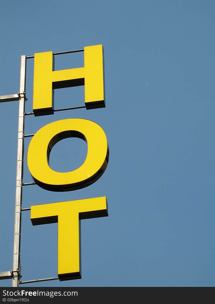 A closeup of the sign of an Hotel