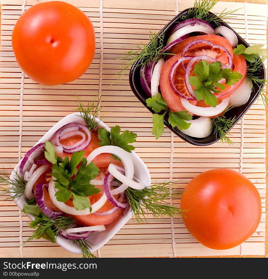 Tomato salad with onion. Vegetarian food.