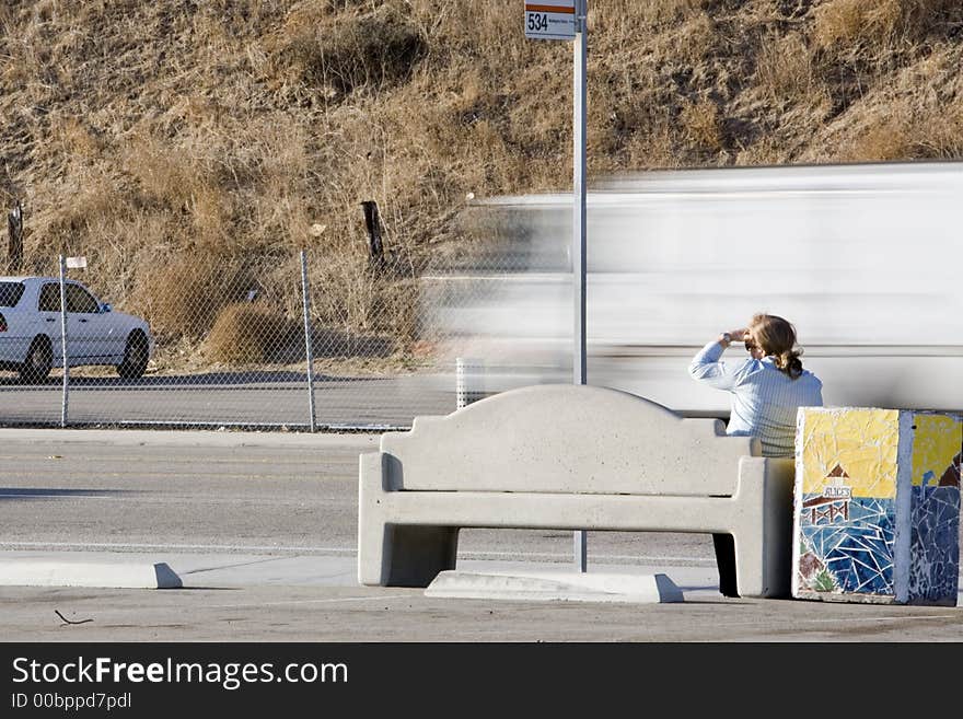 A woman wating for the bus. A woman wating for the bus