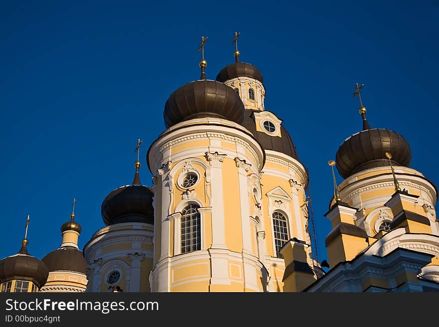 Domes of traditional church with St.-Petersburg in a sunny day