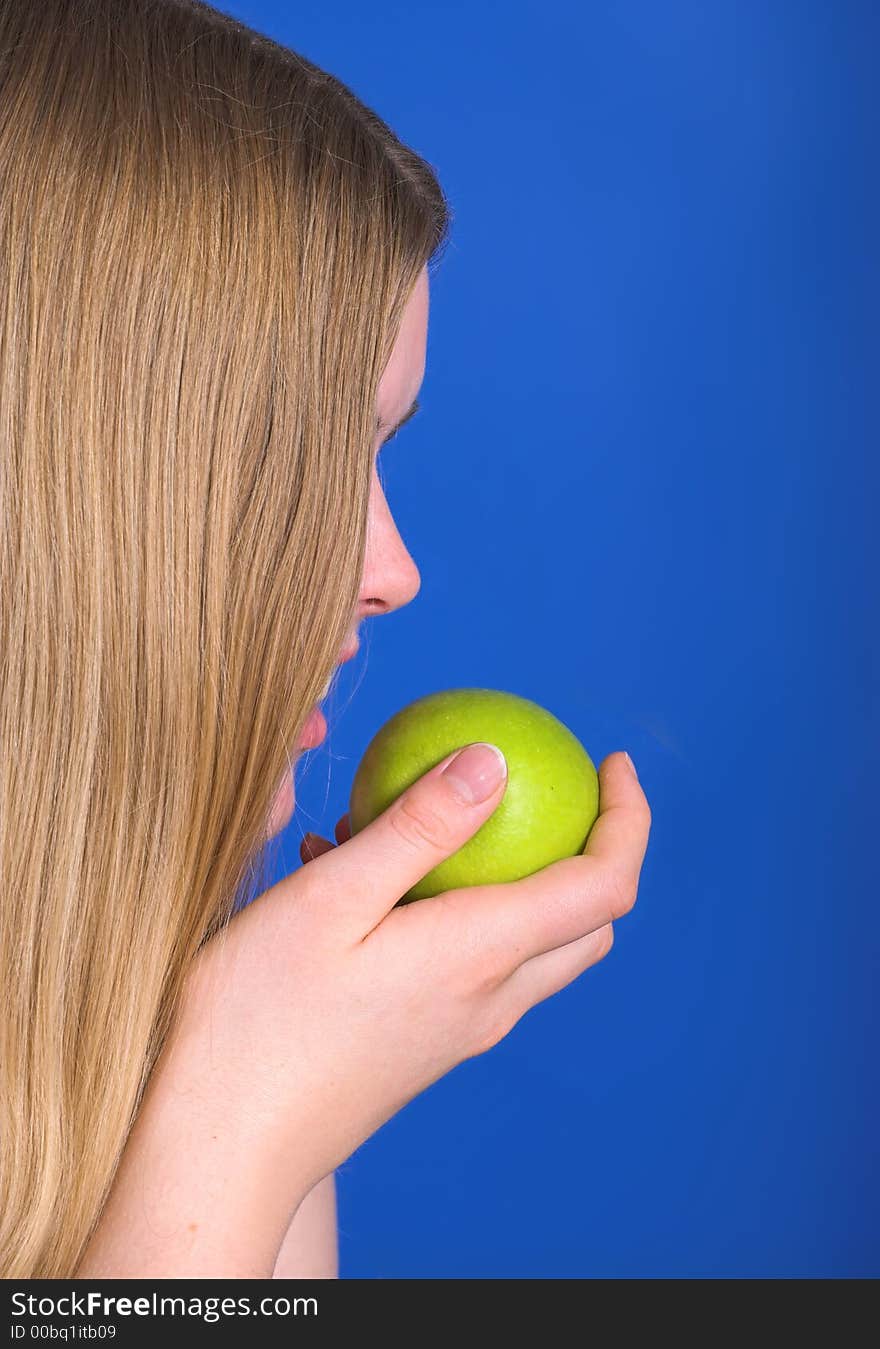 Young woman ready to eat green apple. Young woman ready to eat green apple