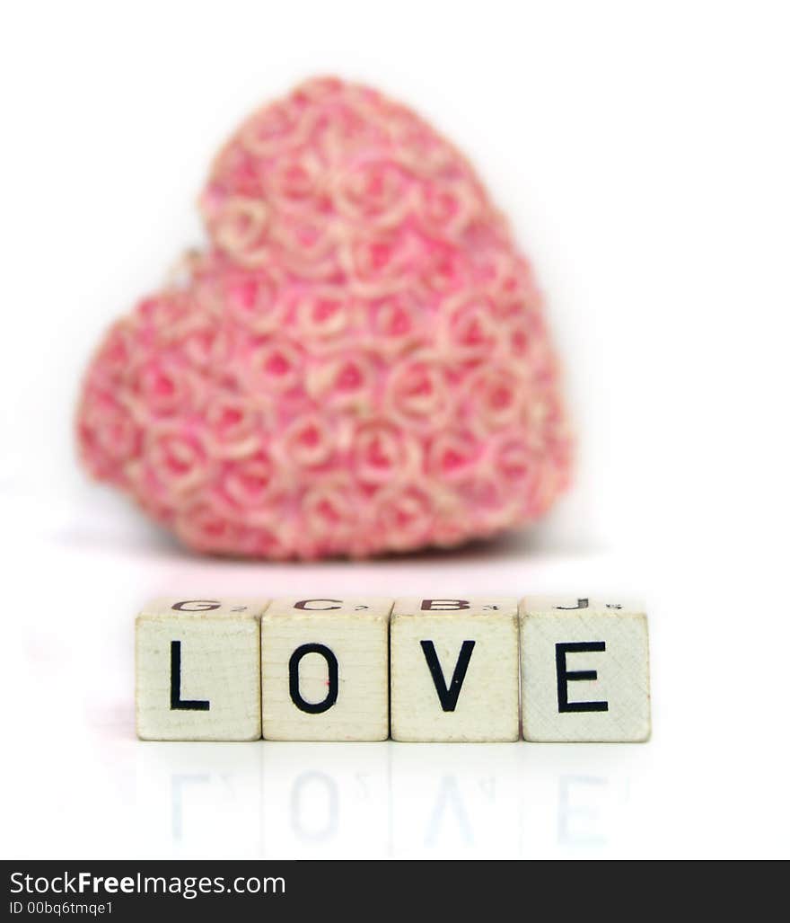 A red heart and cubes with letters on a white background - Love Valentine Â´s Day