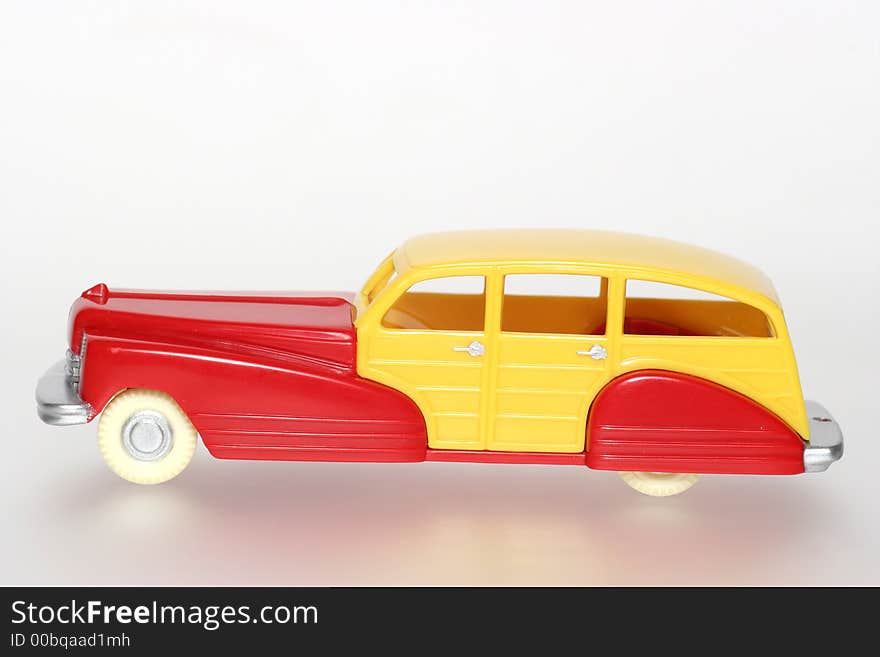 Plastic toy car in 40 s 50 s style sideview