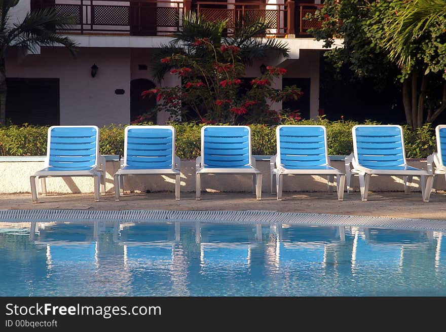 Blue and white swimming pool chairs