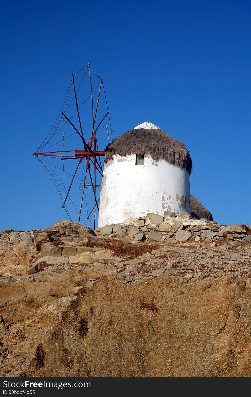 Traditional windmill on the Greek island of Mykonos. Traditional windmill on the Greek island of Mykonos