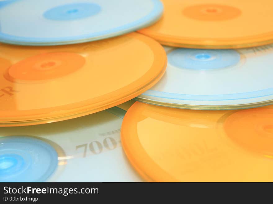 A pile of CDs with colorful covers