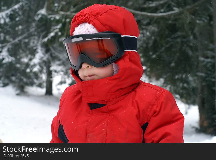 Two and a half year old girl enjoying her first skiing experience. Two and a half year old girl enjoying her first skiing experience.