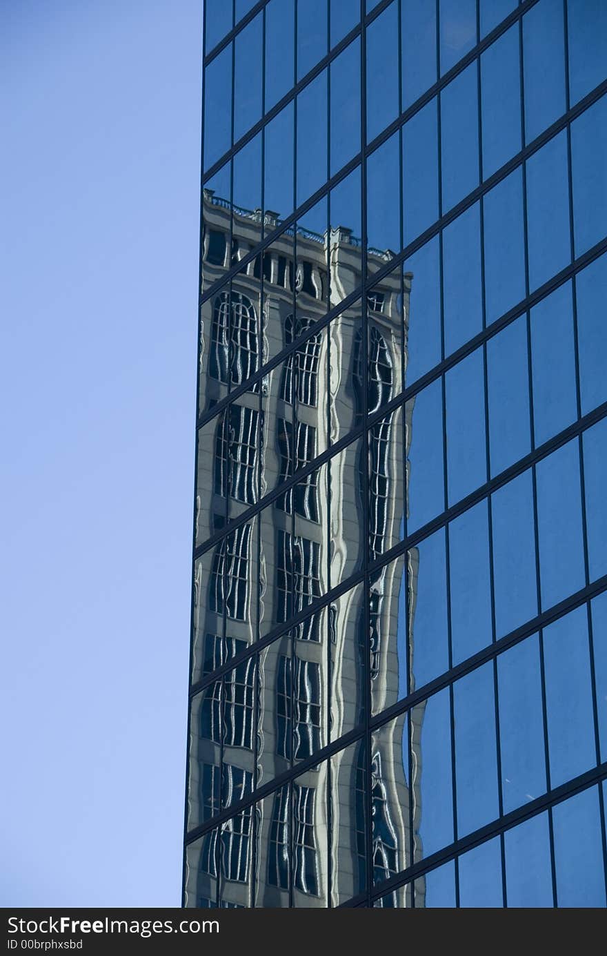 The John Hancock Tower in Boston, MA, USA on a clear sunny day. The John Hancock Tower in Boston, MA, USA on a clear sunny day