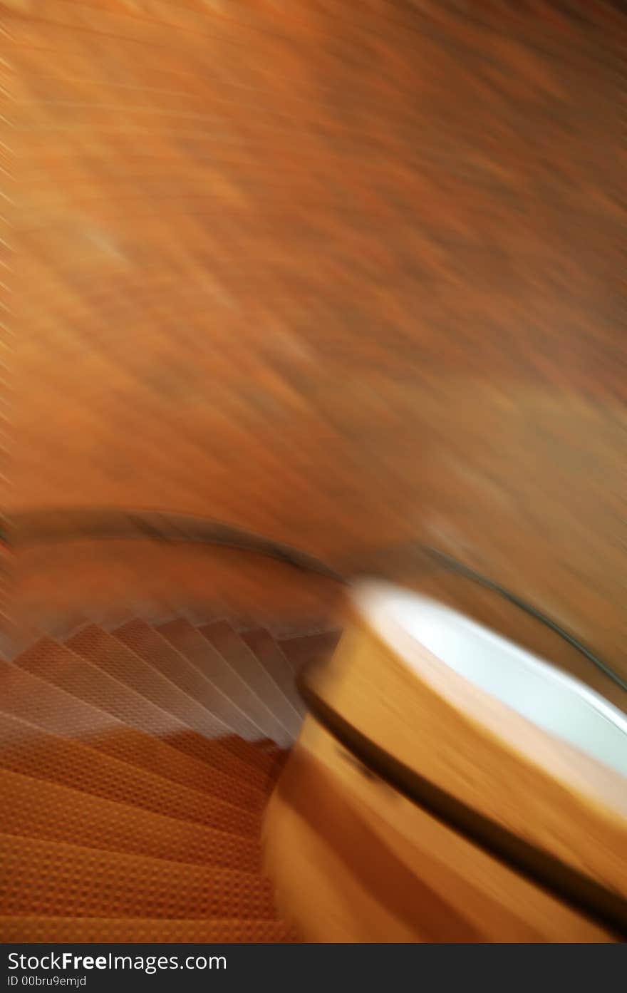 A speedy spiral staircase indoors, motion blur