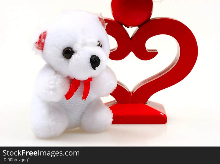 Teddy bear and candlestick isolated on white background