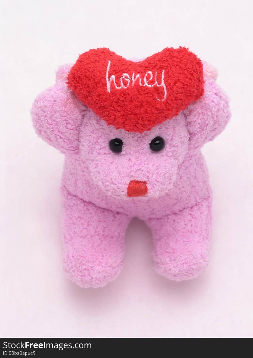 Stuffed valentine's bear holding heart that says honey. Stuffed valentine's bear holding heart that says honey