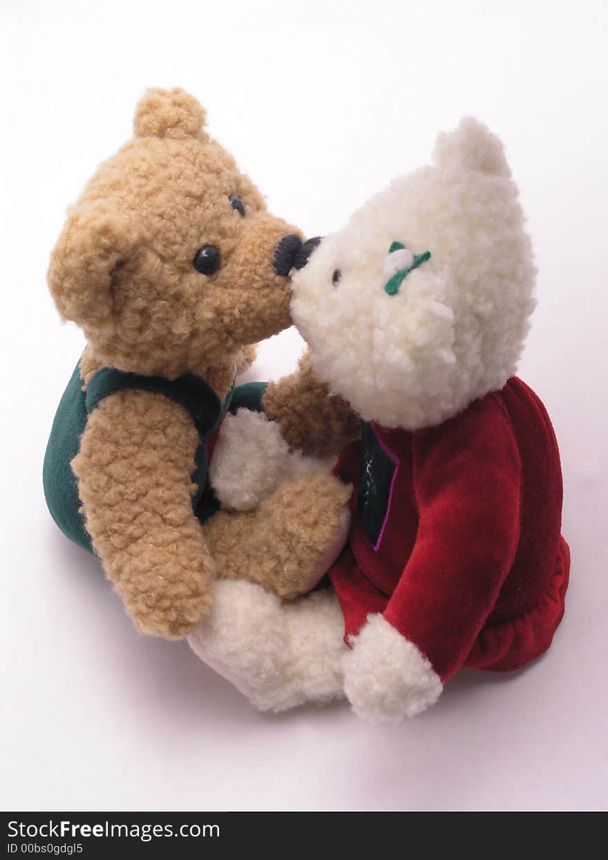 Stuffed male and female valentine's bears kissing. Stuffed male and female valentine's bears kissing