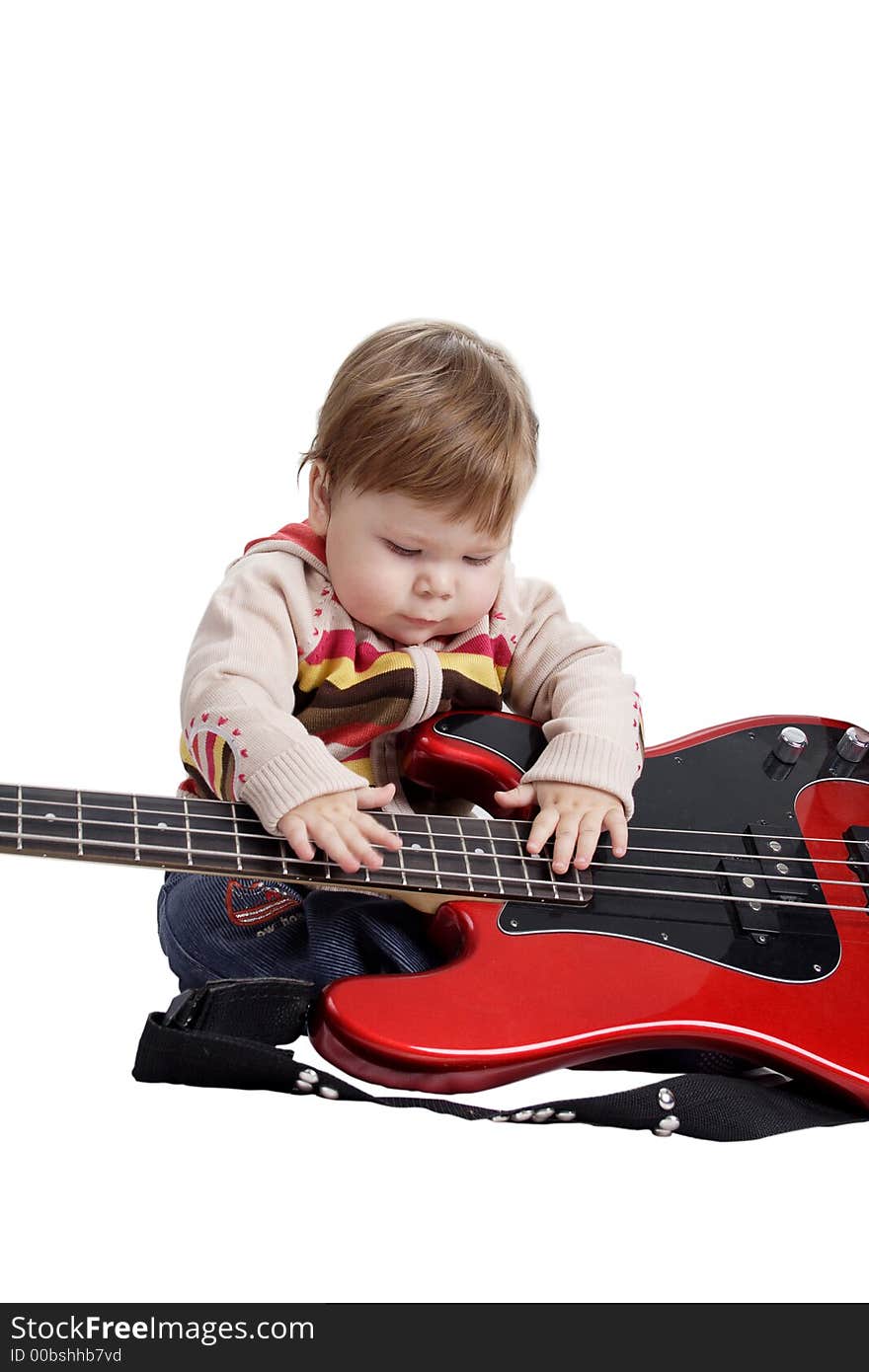 Beautiful baby with guitar. Shot in studio. Isolated on white. Beautiful baby with guitar. Shot in studio. Isolated on white.