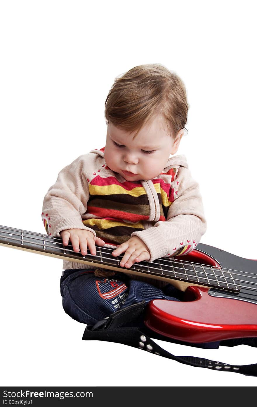 Beautiful baby with guitar. Shot in studio. Isolated on white. Beautiful baby with guitar. Shot in studio. Isolated on white.