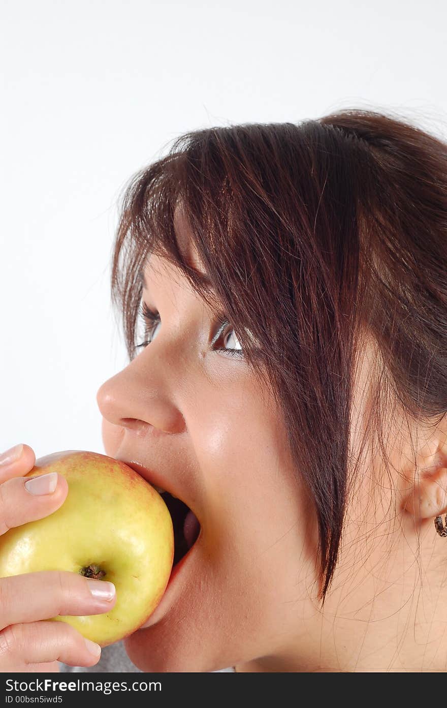 Attractive woman eating apple on white background. Attractive woman eating apple on white background