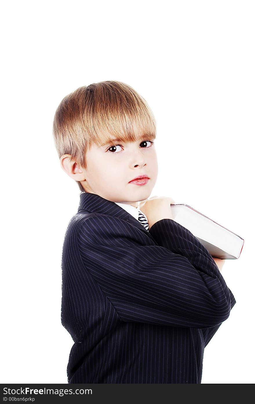 A young boy with his books, against white background. A young boy with his books, against white background.