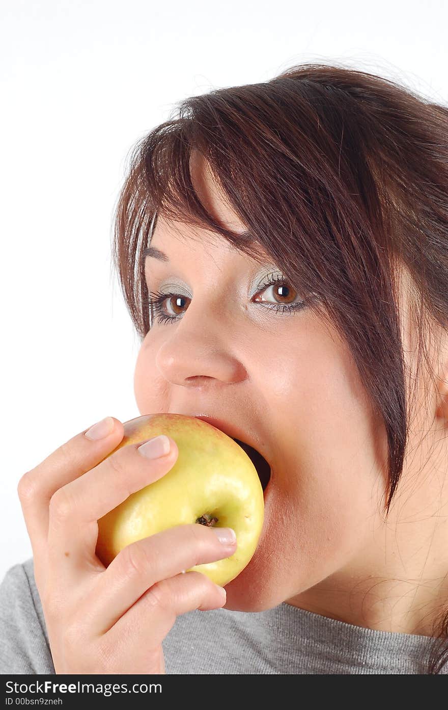 Attractive woman eating apple on white background. Attractive woman eating apple on white background