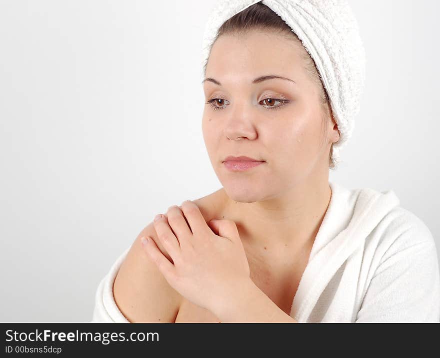 Attractive woman with towel doing self massage. Attractive woman with towel doing self massage