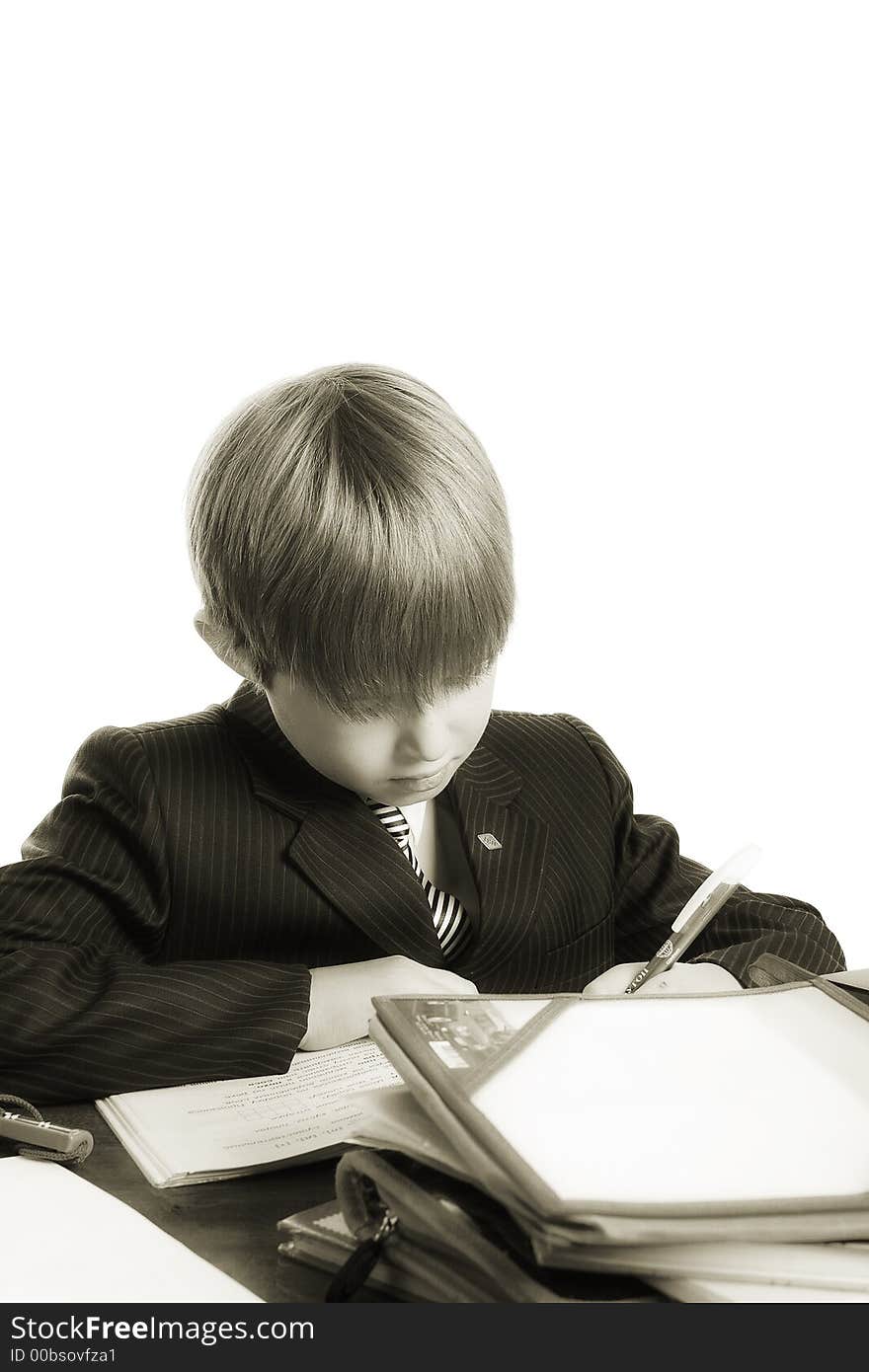 Close-up of boy in business suit. Shot in studio. Isolated with clipping path. Close-up of boy in business suit. Shot in studio. Isolated with clipping path.