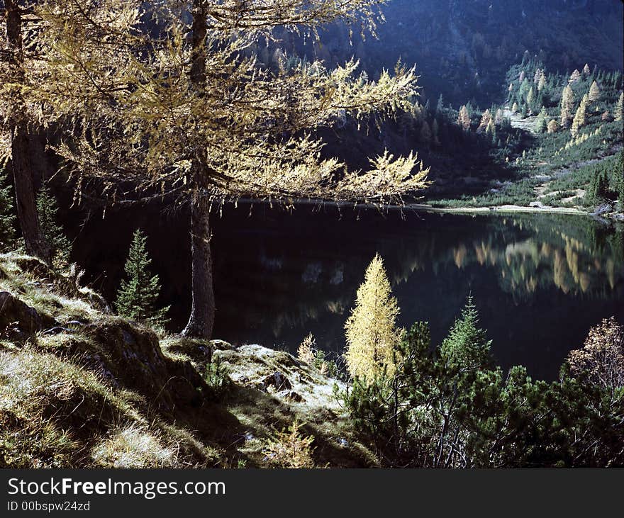 Small lake high up in the mountains, in the clear light of autumn mornings. Small lake high up in the mountains, in the clear light of autumn mornings