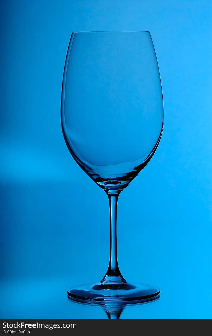 Wineglass on blue