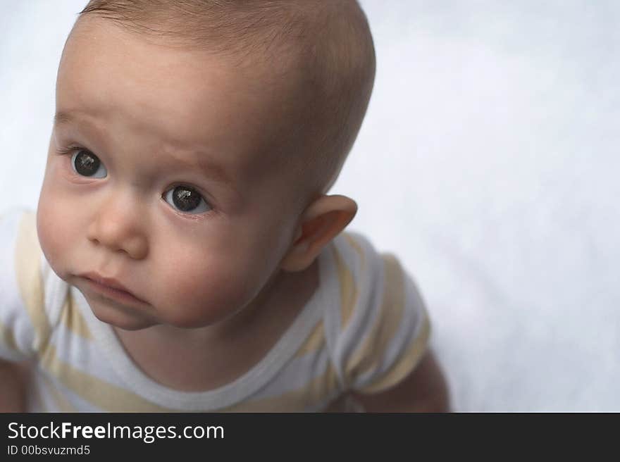 Image of baby looking up at the camera. Image of baby looking up at the camera