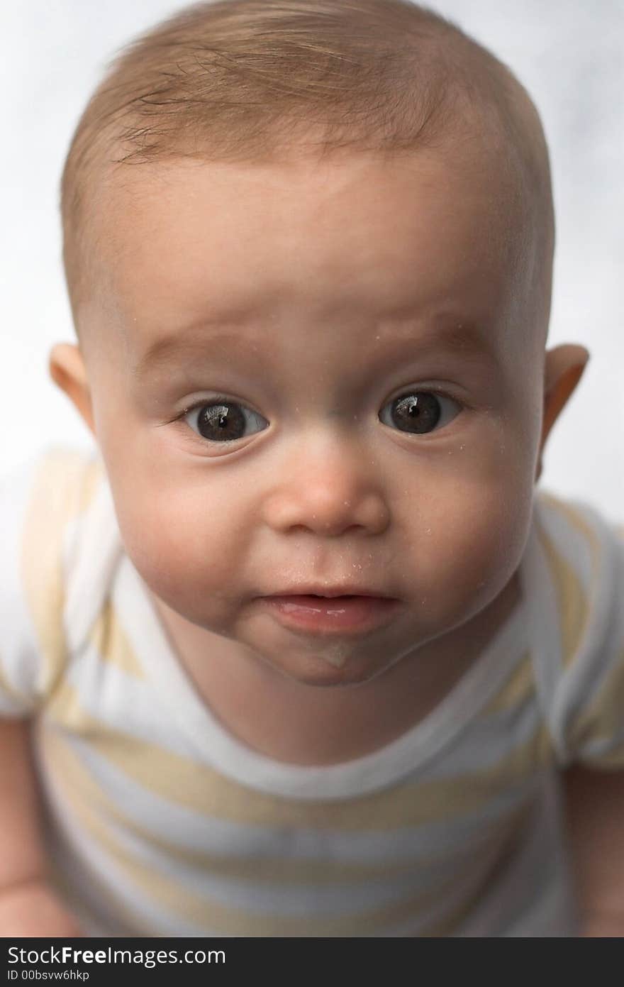 Image of baby looking up at the camera. Image of baby looking up at the camera