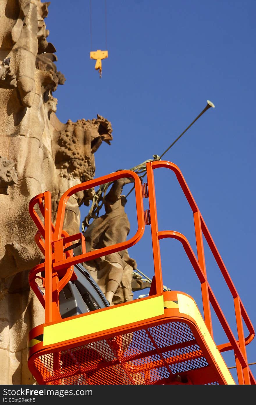 Detail of the crane working at  the towers of la Sagrada Familia at the city of Barcelona, Catalunya, Spain, Europe. Detail of the crane working at  the towers of la Sagrada Familia at the city of Barcelona, Catalunya, Spain, Europe