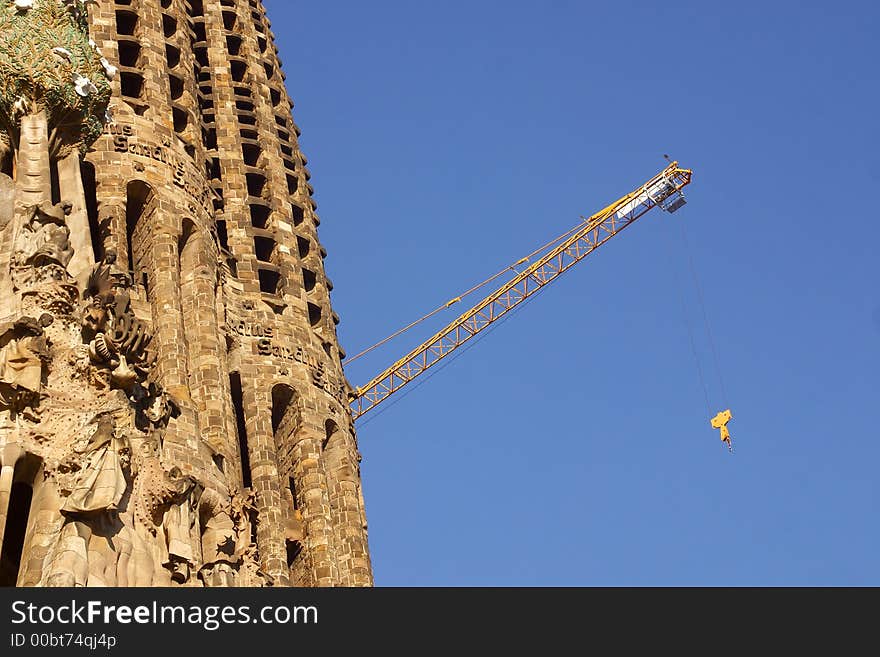 Crane and details of la Sagrada Familia at the city of Barcelona, Catalunya, Spain, Europe. Crane and details of la Sagrada Familia at the city of Barcelona, Catalunya, Spain, Europe