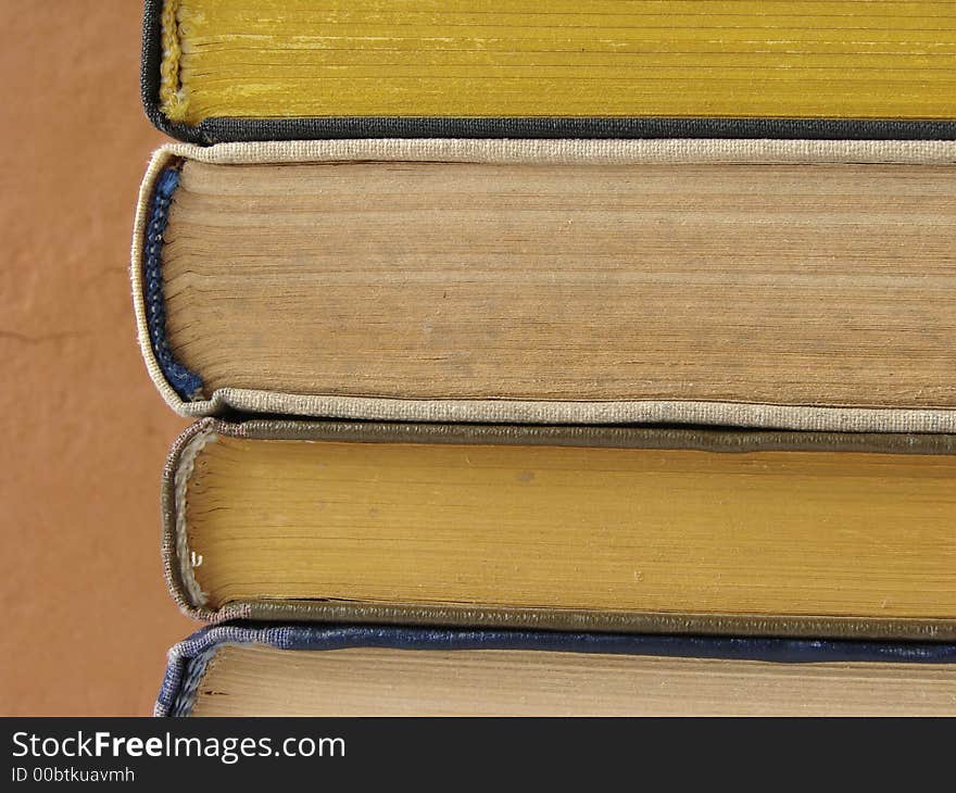 Old books pile fragment closeup