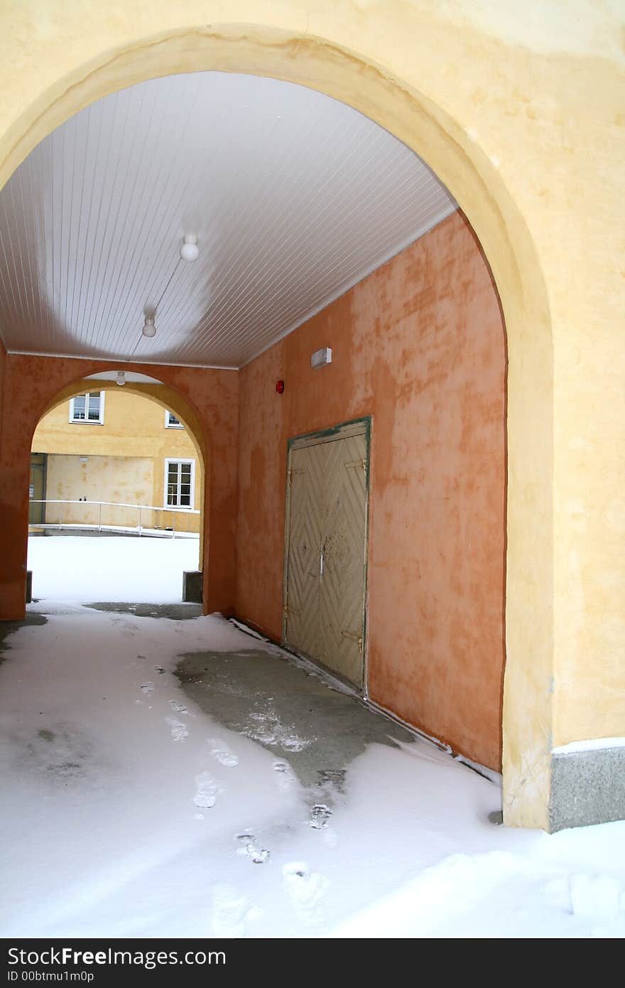 Gateway of a concrete building with arch entrances