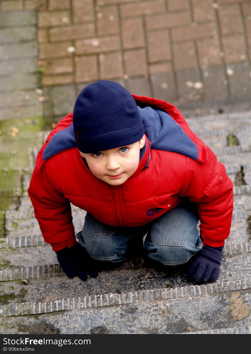 Boy playing on the stairs. Boy playing on the stairs