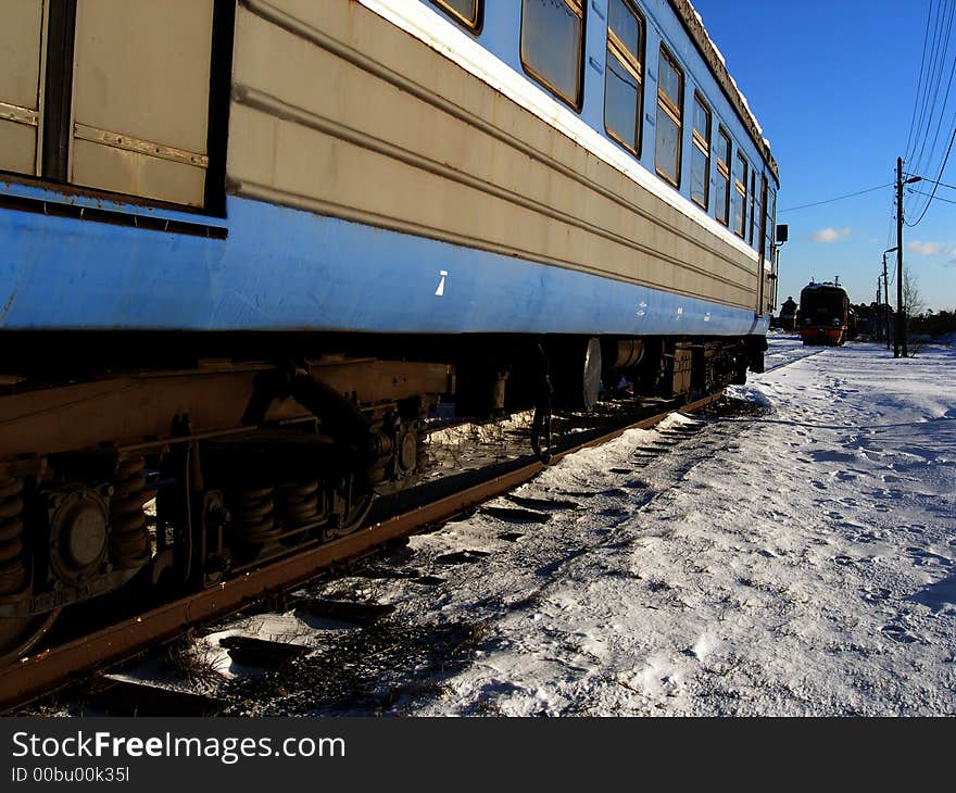 Unsused passenger waggon and train in winter scene. Unsused passenger waggon and train in winter scene