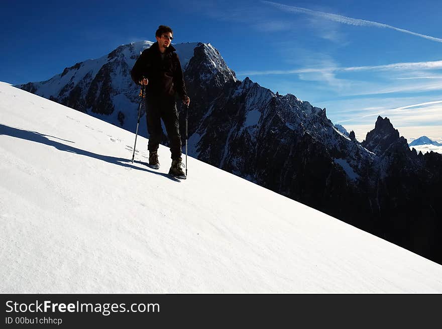 Trekker in front of the west face of Mont Blanc, Italy. Trekker in front of the west face of Mont Blanc, Italy.