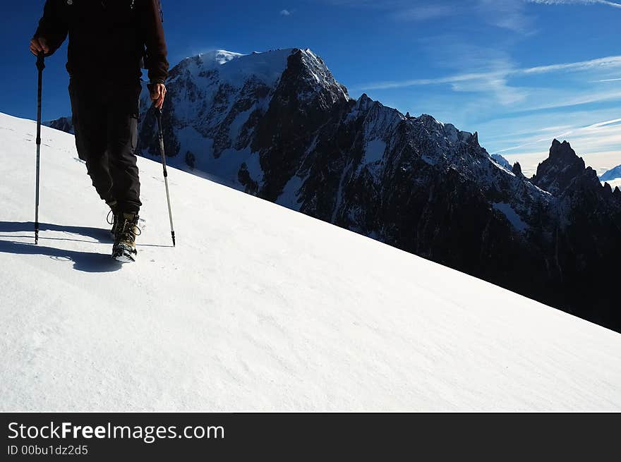 Trekker in front of the west face of Mont Blanc, Italy. Trekker in front of the west face of Mont Blanc, Italy.