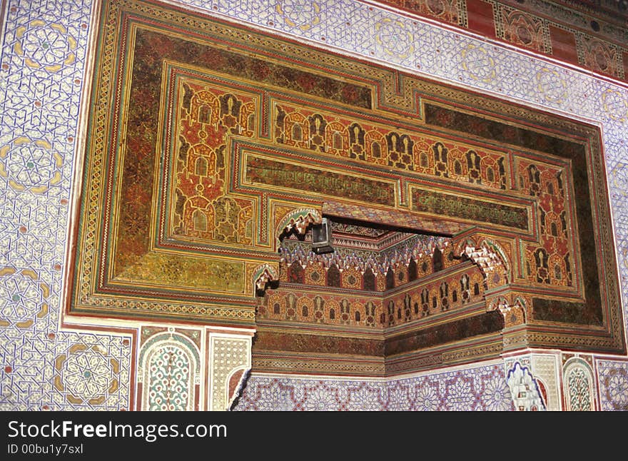 Fully decorated wall and ceiling with typical arabic design of an antique moroccan rich palace in Marrakesh. Fully decorated wall and ceiling with typical arabic design of an antique moroccan rich palace in Marrakesh