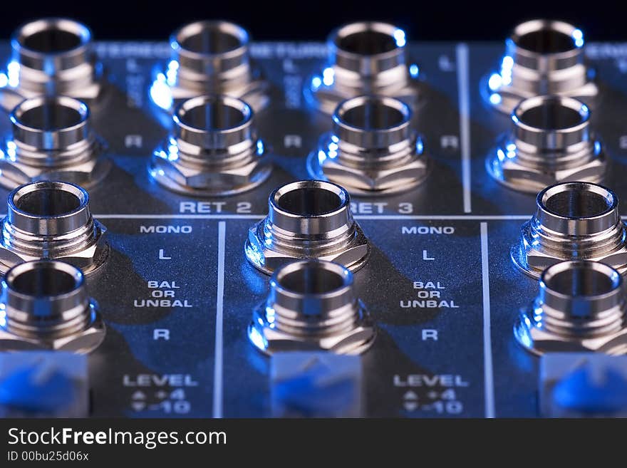 Close-up photo of a sound mixing board. Close-up photo of a sound mixing board