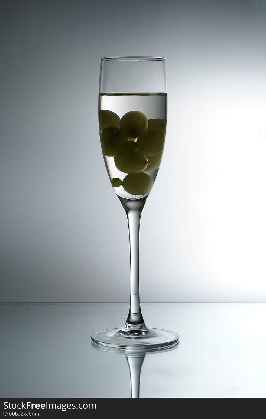 Grapes in the glass of liquid