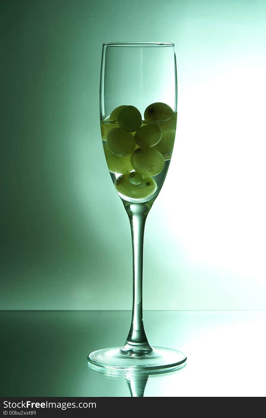 Grapes in the glass of liquid